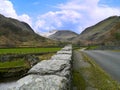 Looking down road, along wall to mountains