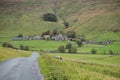Road down to the picturesque village of Halton Gill nestling in the hillside, Yorkshire Dales Royalty Free Stock Photo