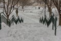 Looking down snow covered stairs at a park in urban Atlanta