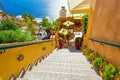 Staircase to restaurant terrace on Caldera cliff edge Santorini island Greece