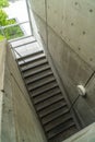 Looking down on staircase with metal handrails inside of commercial building Royalty Free Stock Photo