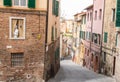 Looking down a steep street in siena, italy.