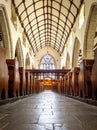 Looking down the stone floored aisle of a small church Royalty Free Stock Photo