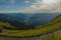 Looking down towards Kitzbuhel aki area and other mountains from the high Kitzbuheler horn on a sunny summer day