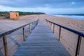 Looking down a wooden decking pathway on a beach Royalty Free Stock Photo