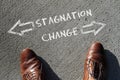 Looking down at the words Stagnation and Change
