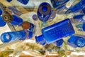 Looking downward on a collection of cobalt glass bottles near Bishop, California, USA - November 6, 2022 Royalty Free Stock Photo