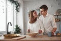 Looking at each other with love. Having nice time together on the kitchen on weekend and preparing food Royalty Free Stock Photo