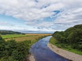 Looking East over Kinnaber Links with the River North Esk flowing towards St Cyrus beach Royalty Free Stock Photo