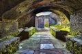 Looking at the exit inside the thermal`s mithraeum in archaeological excavations in Ostia Antica - Rome Royalty Free Stock Photo