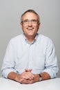 Looking forward to retirement. Studio shot of excited-looking older man looking upwards.