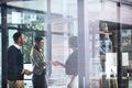 Looking forward to working together. businesswomen shaking hands in a modern office. Royalty Free Stock Photo