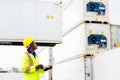Looking forword. Foreman using laptop computer in the port of loading goods. Foreman showing thumbs up on Forklifts in the Royalty Free Stock Photo