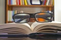 Looking glasses on an open book Royalty Free Stock Photo