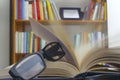 Looking glasses on an open book Royalty Free Stock Photo