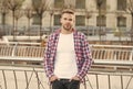 Looking good. student walk in city. handsome young man wear checkered shirt. casual dressed male fashion model posing Royalty Free Stock Photo