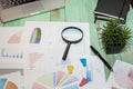 Looking at growth chart with magnifying glass. Graphs, charts and magnifying glass. Royalty Free Stock Photo