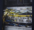 Looking through honeycomb pattern doors inside modern big data server rack in data center with network servers hardware and