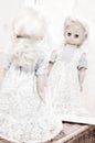 Looking for identity - vintage doll at the mirror Royalty Free Stock Photo