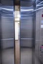 Looking from inside a silver elevator to the outside with the doors partially opened Royalty Free Stock Photo