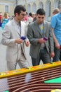 Looking men at Board games. The townspeople were laughing playing table formula 1. Royalty Free Stock Photo