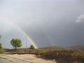 Looking from the mountain to double rainbow