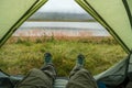 Looking at the nature from a tent in wild, while hiking in Iceland Royalty Free Stock Photo