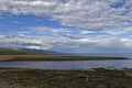 Looking North from the outlet of the River Brora on a calm Summers Evening at Low Tide.