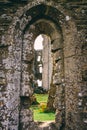 Looking through old castle window at ruins Royalty Free Stock Photo