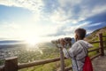 Looking out through binoculars at a beautiful mountain view Royalty Free Stock Photo