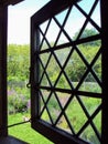 Looking out from a diamond grid window at the Oldest House on Nantucket island, Massachusetts