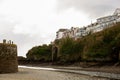 Looking out end of quay with West Looe houses on hill. Cloudy Spring day. Looe Harbor, Cornwall, UK - April 2nd 2019 - April 3rd Royalty Free Stock Photo