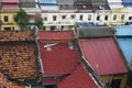 Looking out over colorful tile rooftops in urban Southeast Asia