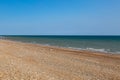 Looking out over the pebble beach and ocean, at Cooden Beach on the Sussex coast