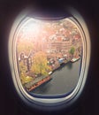 Looking out the plane windows. Beautiful scenic Amsterdam city view through the airplane window. Flying over the Net