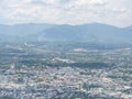Looking out at the window airplane sees the landscape city view of Chiang Rai, Thailand. Top view of beautiful mountains, forest Royalty Free Stock Photo