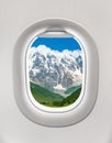 Looking out the window of a plane to the mountains in Georgia Royalty Free Stock Photo
