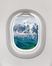 Looking out the window of a plane to the mountains in Georgia Royalty Free Stock Photo