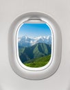 Looking out the window of a plane to the mountains in Georgia Royalty Free Stock Photo