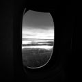 Looking outside plane from the window Royalty Free Stock Photo