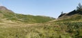 Looking over grassy col area to ridge ahead, panoramic