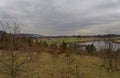 Looking over a Nature Reserve set within the Forfar Valley, with snow on the surrounding hills Royalty Free Stock Photo