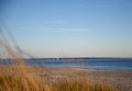 Looking over the sand dunes at the ocean. Royalty Free Stock Photo