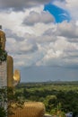 Looking over shoulder of Golden Buddah statue at Dambulla, Sri L Royalty Free Stock Photo