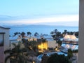 Looking over Spanish Roof Tops to the Sea and beyond as the Sun Royalty Free Stock Photo