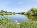 Still water of Staunton Harold Reservoir on a summer day