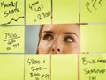 Looking at a plan from a holistic point of view. a young woman having a brainstorming session with sticky notes at work.