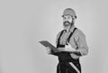 looking project folder. blueprint in folder. making notes in clipboard. portrait of engineering man. construction worker Royalty Free Stock Photo