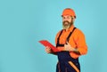 Looking project folder. blueprint in folder. making notes in clipboard. portrait of engineering man. construction worker Royalty Free Stock Photo
