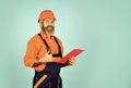 Looking project folder. blueprint in folder. making notes in clipboard. portrait of engineering man. construction worker Royalty Free Stock Photo